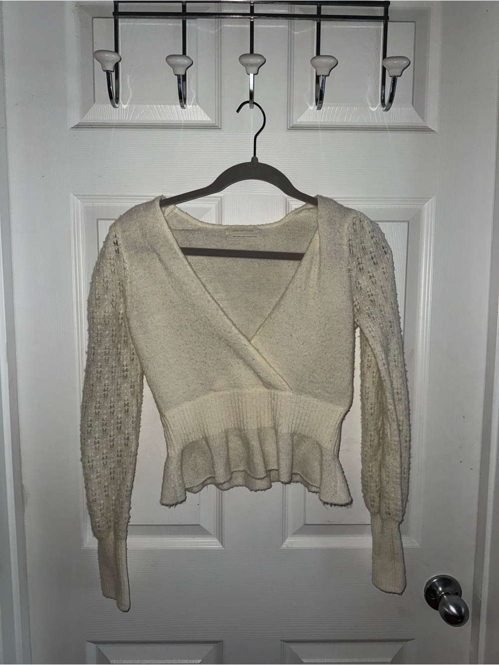 Urban Outfitters Cream V‑Neck Wrap Peplum Sweater